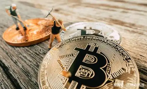 A technician examines the cooling system of a Bitmain Antminer.