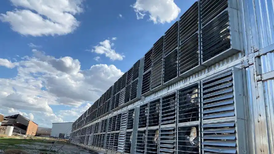 A sprawling mining farm with numerous cooling systems to manage heat