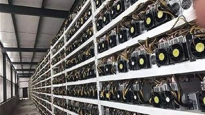Dutch offshore wind powered mining farm in Rotterdam, showcasing stacks of Antminer rigs cooling under natural airflow